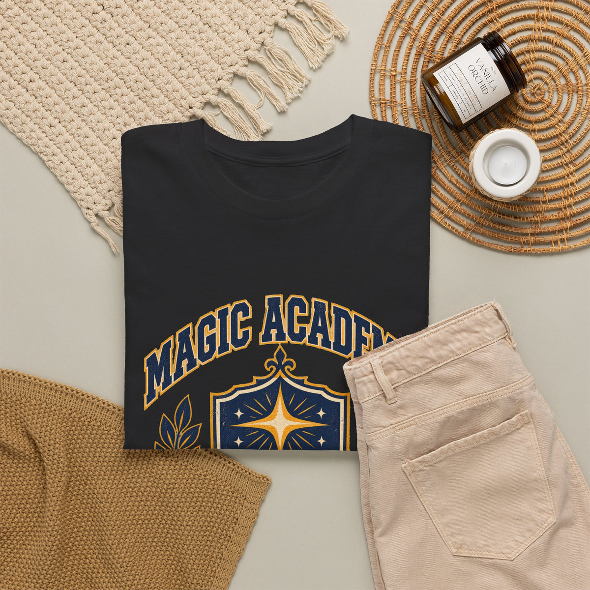 Magic Academy varsity tee in black, folded – Magic Academy Varsity design, official Roco Kingdom merch