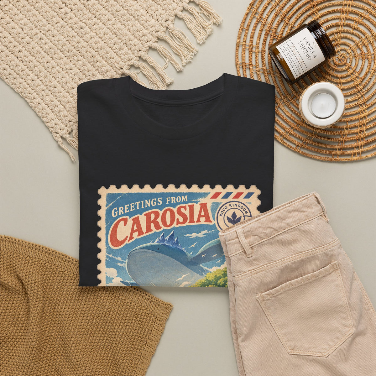 Carosia stamp shirt in black, folded – Greetings from Carosia Stamp design, official Roco Kingdom merch